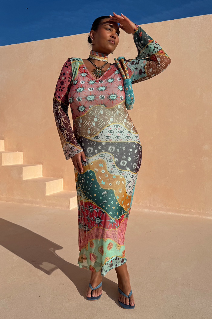 Multi-wear Pastel Morocco Mesh Vivi Dress with sun and eye motifs in sheer multi-colour mesh on a curve model.