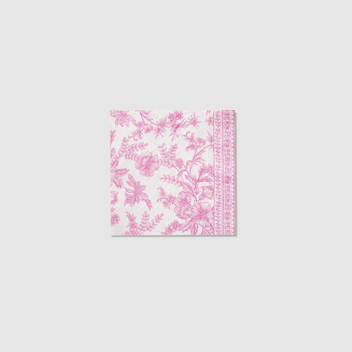 A table set with Pink French Toile Paper Party Dinnerware plates from Coterie Party Supplies featuring floral toile dinnerware patterns that evoke the charm of the French countryside, complemented by silverware.