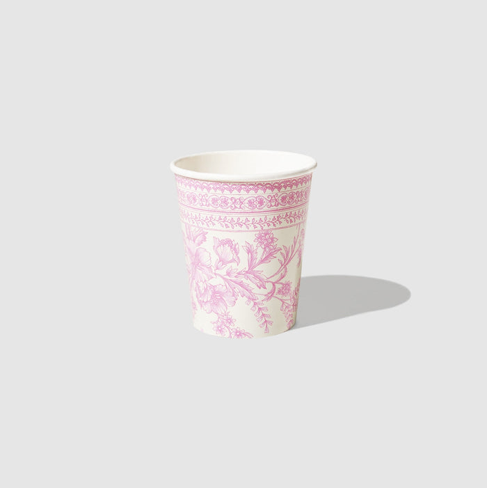 A table set with Pink French Toile Paper Party Dinnerware plates from Coterie Party Supplies featuring floral toile dinnerware patterns that evoke the charm of the French countryside, complemented by silverware.
