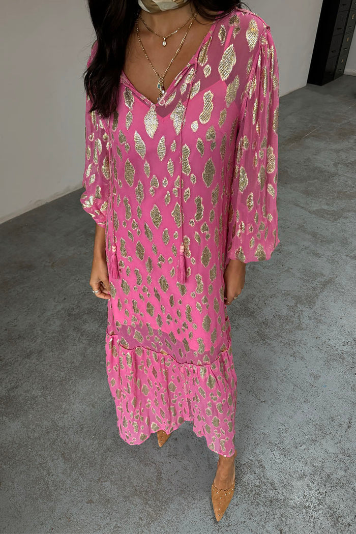 Petite Pink Jacquard Harmony Dress featuring a gold animal print, v-neckline tassels and tiered skirt.