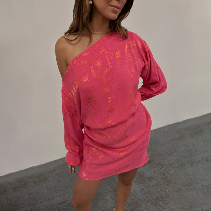 Pink Safari Mini Tilly Dress in pink jacquard with orange sun and palm prints, styled off-the-shoulder.