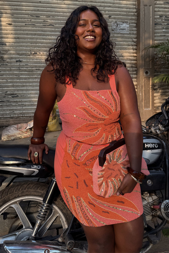Pink Sol Beaded Top with a sequin sun print, styled as a co-ord for a London street style look.