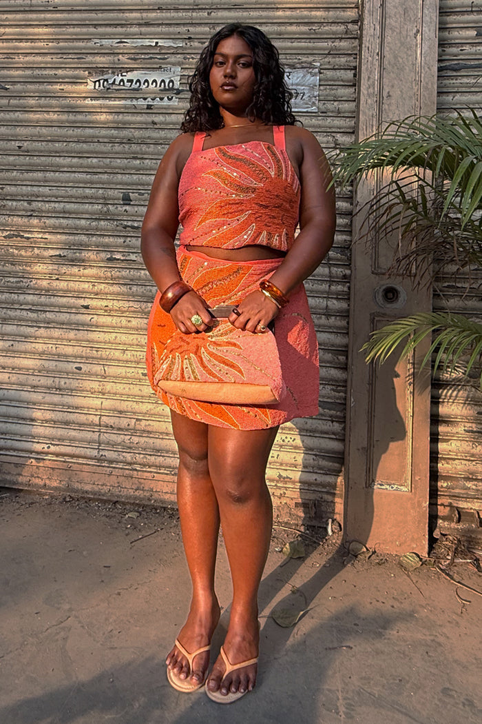 Pink Sol Beaded Top with a hand-embroidered sun print and sequins, styled as a co-ord with the matching skirt.
