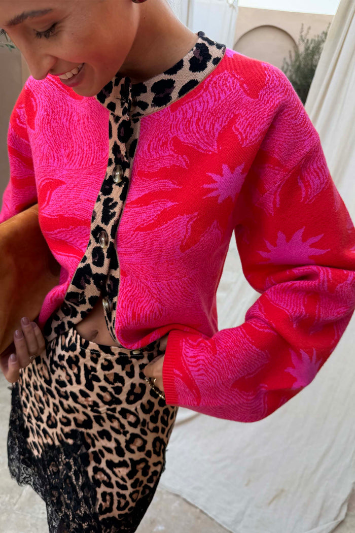 Pink Soleil Cardigan with sun motifs and leopard trim, a soft knit style designed in London.
