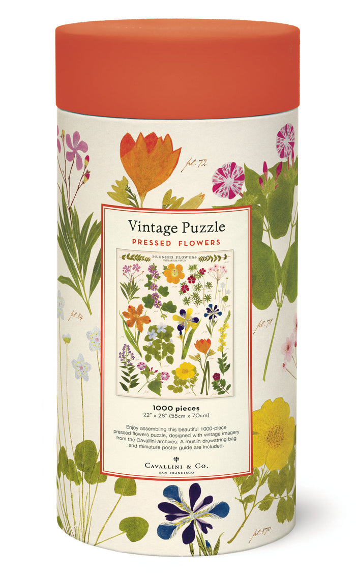 A jigsaw puzzle box with a floral design, labeled "Pressed Flowers Puzzle," containing 1000 pieces. Made by Cavallini Papers & Co.