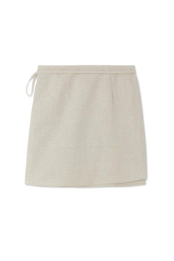 Cream Raffia Wrap Skirt featuring a textured woven fabric and side tie fastening.
