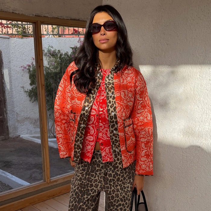 Red Bandana Reversible Jacket in quilted fabric with leopard trim, styled with leopard print trousers.