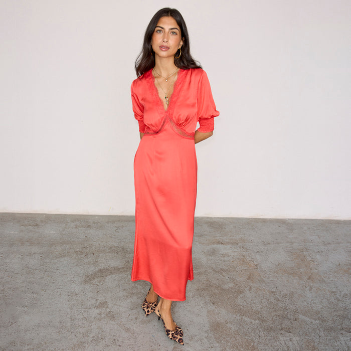 Red May Dress featuring lace detailing, a V-neck and puff sleeves, styled with leopard print heels.