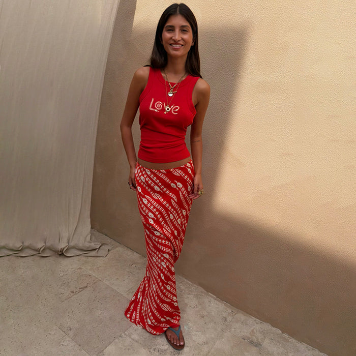 Red Snake Print Dorris Skirt in a satin-feel viscose, paired with a matching red tank top featuring a Love graphic.