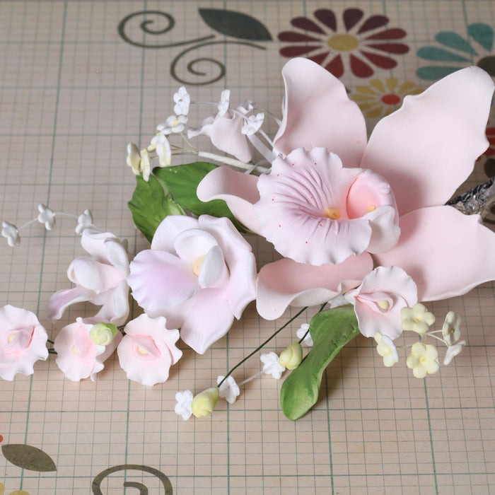 Large Cymbidium Orchid Gumpaste Sugarflower Sprays perfect as a cake topper for cake decorating fondant cakes.  Wholesale Sugarflowers and cake supply. Caljava