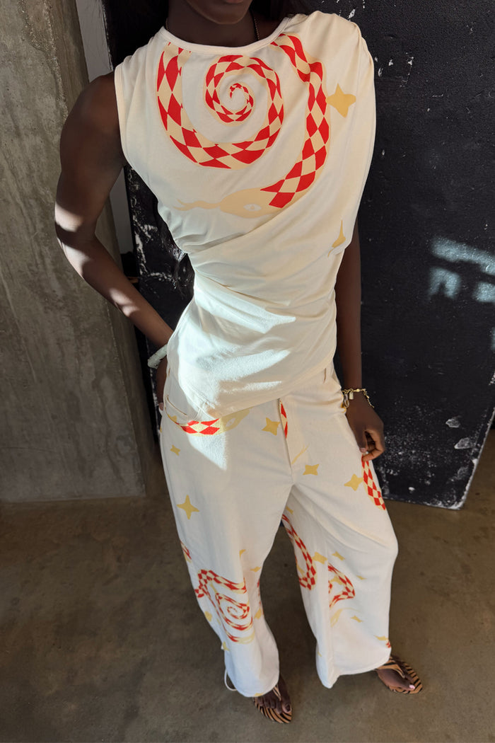 White Snake Tie Side Trousers in cotton twill with red snake and star motifs, styled as a co-ord with the matching top.
