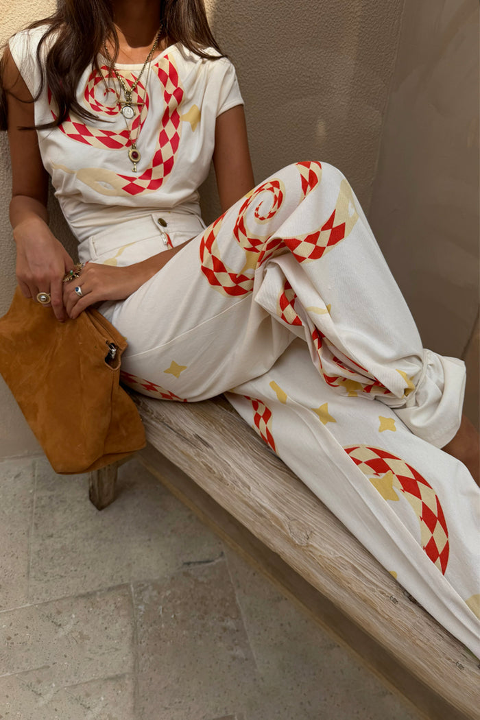 White Snake Tie Side Trousers in cotton twill with red snake motifs, styled as a wide leg co-ord with a matching top.