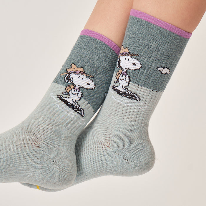 Aqua marl crew compression socks with a Snoopy Beagle Scout design, worn in a lifestyle setting.