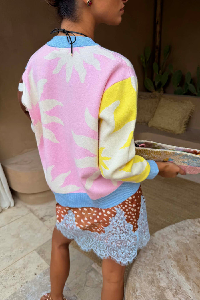 Soleil Hollie Cardigan in pastel pink and yellow soft touch knit with white sun motifs and blue ribbed trims.