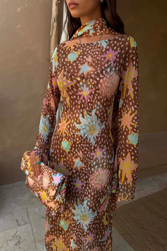Star Fawn Aria Mesh Dress in brown with celestial motifs, flared sleeves and a matching printed clutch bag.