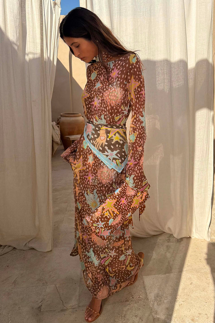 Brown Star Fawn Aria Dress featuring a fawn print with sun and star motifs, styled with a matching bandana.