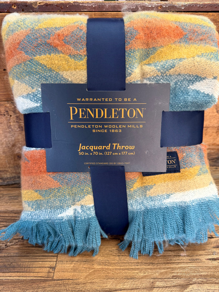 Pendleton jacquard throw blanket with multicolor Aztec pattern and blue fringe, boxed