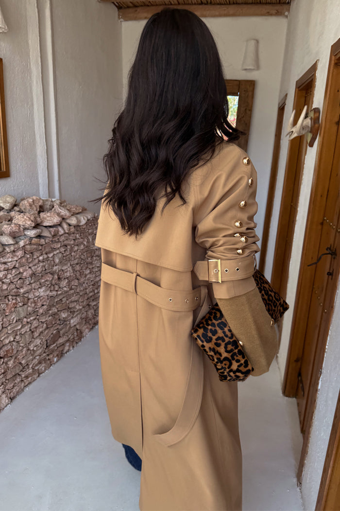 Tan Trench Coat with gold stud sleeve detailing and belted back, styled with a leopard print bag.
