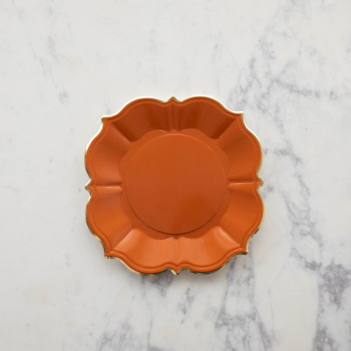 An orange scalloped plate.