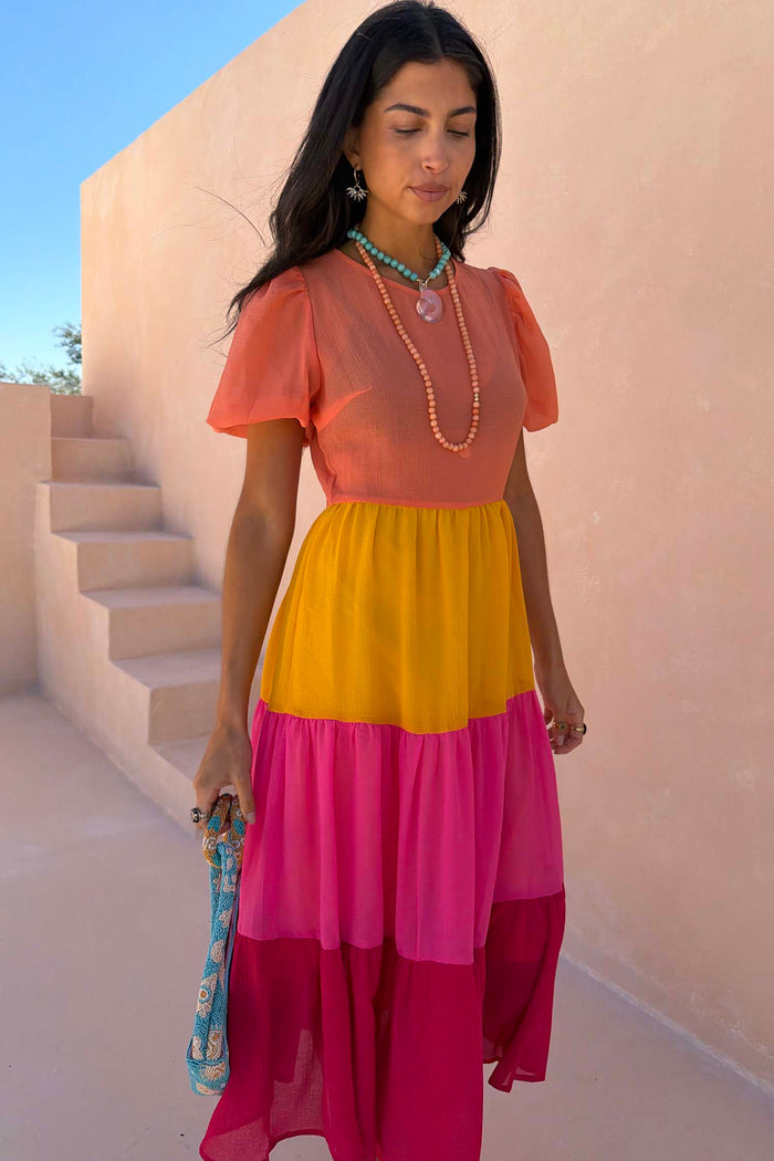 Tiered Orange and Pink Abigail Dress featuring a sheer bodice and colour-blocked panels in a maxi silhouette.