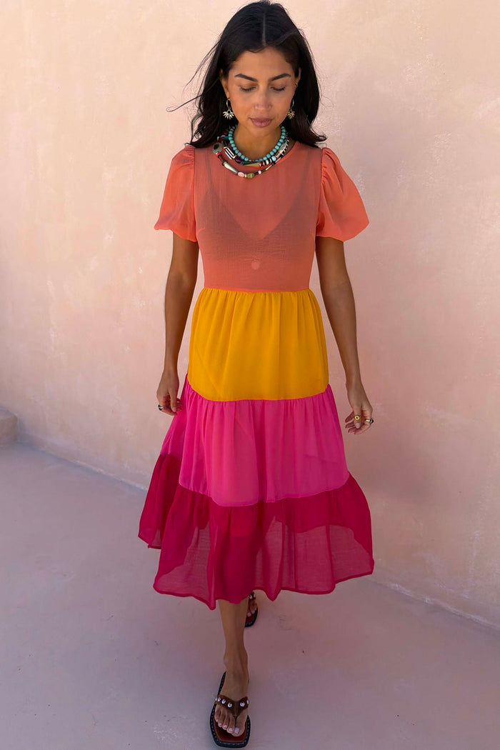 Petite Tiered Orange and Pink Abigail Dress featuring a sheer bodice and floaty skirt in bold summer tones.