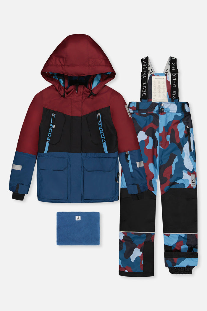 Deux par Deux TEKNIK two-piece snowsuit: burgundy, black and blue jacket, camouflage snow pants, neck warmer